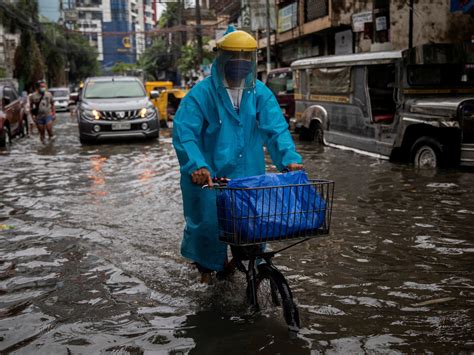 Philippines evacuates thousands as monsoon rains flood Manila.